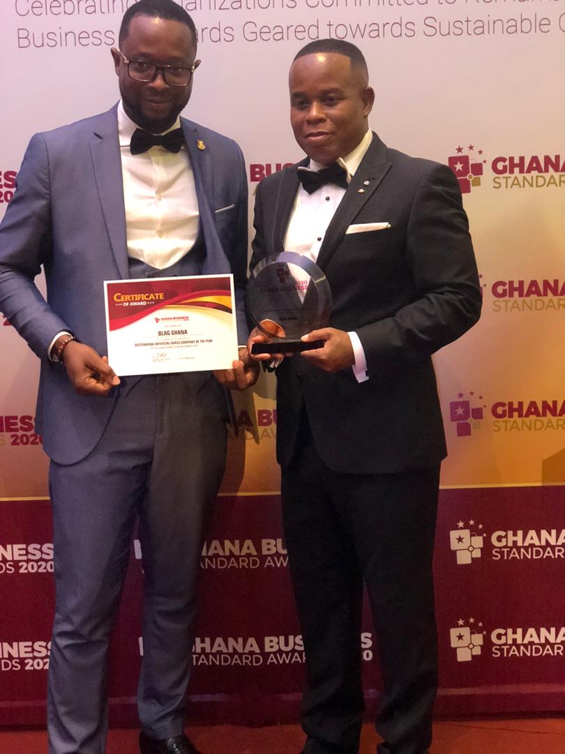 Mr Eddie Dankwa (right) and Sales Manager of BLAG Ghana, Samuel Mighty holding the plague and certificate of the award BLAG Ghana honoured