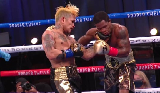 John Riel Casimero (left) lands a left hook to the jaw of Duke Micah