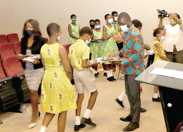 Some officials of the Ghana Book Development Council distributing storybooks to students after the event. Picture: EDNA SALVO-KOTEY Some officials of the Ghana Book Development Council distributing storybooks to students after the event. Picture: EDNA SALVO-KOTEY