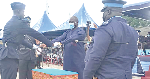 Col. Kwadwo Damoah (retd) presenting a sword to Senior Cadet Stephen Joshua Agah, the Overall Best Trainee