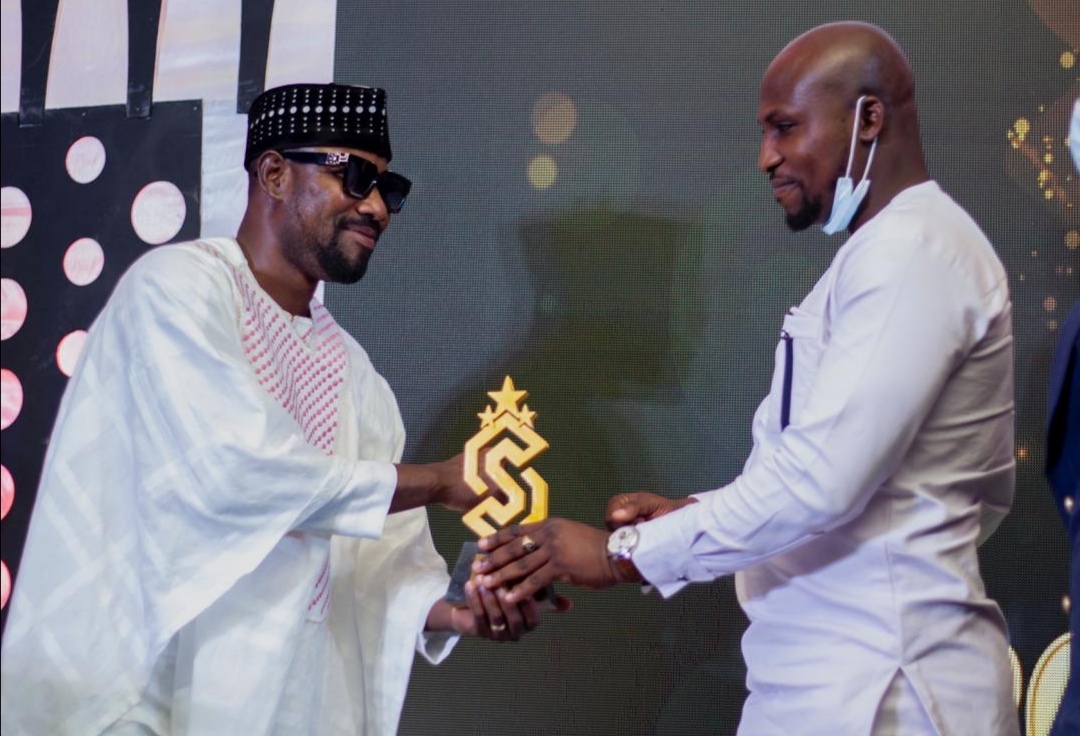 Mr Lord Ibrahim Sani (right), CEO, Sani Group Limited receiving his award 