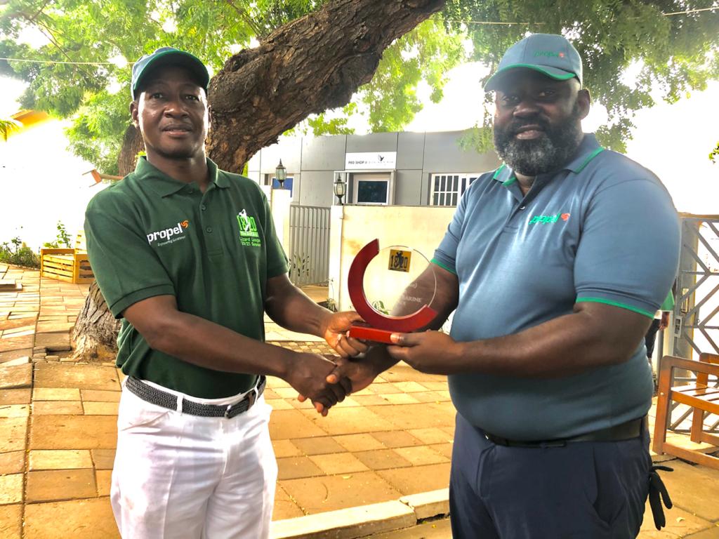 Mr Eliphas Barine receiving his trophy from Mr Wilson Krofah (left), the MD of Ready Africa Ghana Limited Mr Eliphas Barine receiving his trophy from Mr Wilson Krofah (left), the MD of Ready Africa Ghana Limited