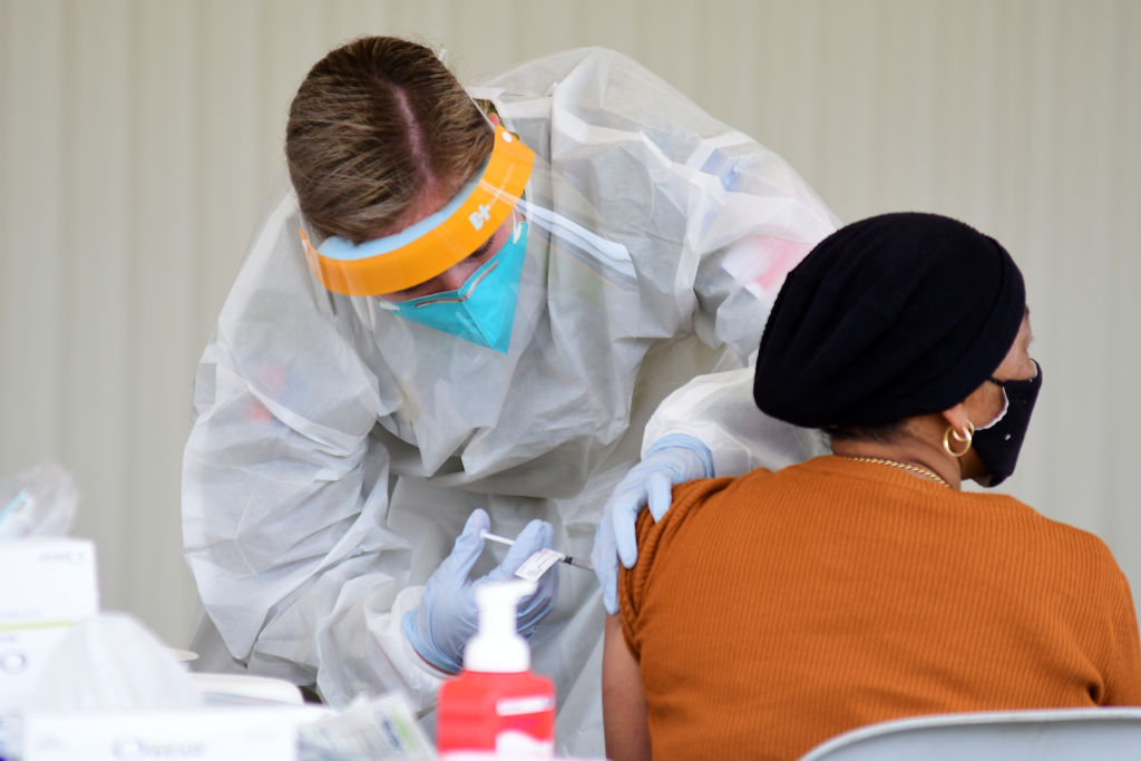 Australia reports record Covid-19 cases as Sydney hospitals set up emergency tents