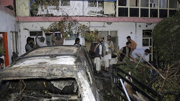 Afghan people are seen inside a house after U.S. drone strike in Kabul, Afghanistan, Sunday, Aug. 29, 2021. Afghan people are seen inside a house after U.S. drone strike in Kabul, Afghanistan, Sunday, Aug. 29, 2021.