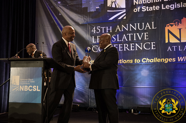 President Akufo-Addo receives the award from Representative Billy Mitchell President Akufo-Addo receives the award from Representative Billy Mitchell
