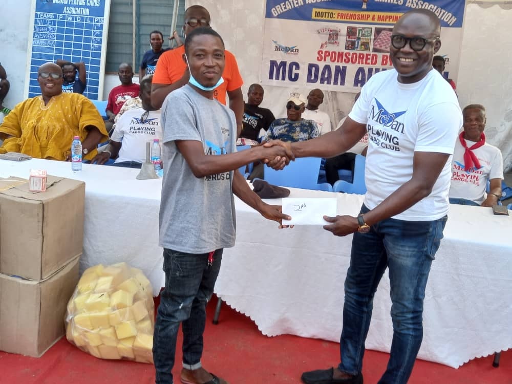 Mr Julien Lartey (right) awarding a participant a certificate of participation McDan encompasses all sports