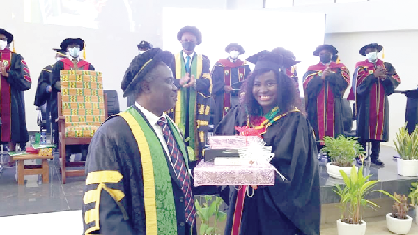 Miss Elizabeth Naa Abiana Morton (right) receiving one of her 9 awards from Prof. John Owusu Gyapon, Vice Chancellor of UHAS. Miss Elizabeth Naa Abiana Morton (right) receiving one of her 9 awards from Prof. John Owusu Gyapon, Vice Chancellor of UHAS.