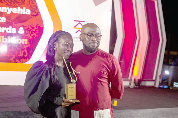 Mr Elikem Kuenyehia, Founder of Kuenyehia Trust, with Ms Lois Arde-Acquah, the award winner Mr Elikem Kuenyehia, Founder of Kuenyehia Trust, with Ms Lois Arde-Acquah, the award winner