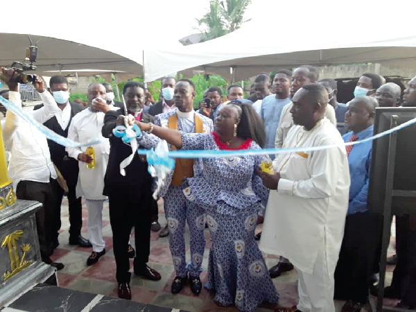 His Eminence, Most Rev. Dr Charles Agyinasare (2nd from left), Presiding Bishop of the Perez Chapel International, being assisted by Rev. Mrs Seyram Hodzi, the wife of the General Overseer of Destiny Carriers Ministry, to cut the tape to inaugurate the facility. His Eminence, Most Rev. Dr Charles Agyinasare (2nd from left), Presiding Bishop of the Perez Chapel International, being assisted by Rev. Mrs Seyram Hodzi, the wife of the General Overseer of Destiny Carriers Ministry, to cut the tape to inaugurate the facility.