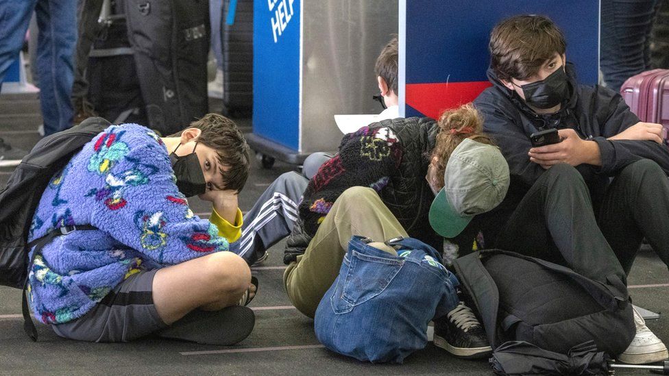 Travellers wait for their delayed Delta Airlines flight at Los Angeles International Airport, California [Photo Credit: Getty Images]