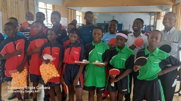 Students and Staff of Ekis Montessori displaying the items ITTF donates ping-pong equipment to Ekis Montessori