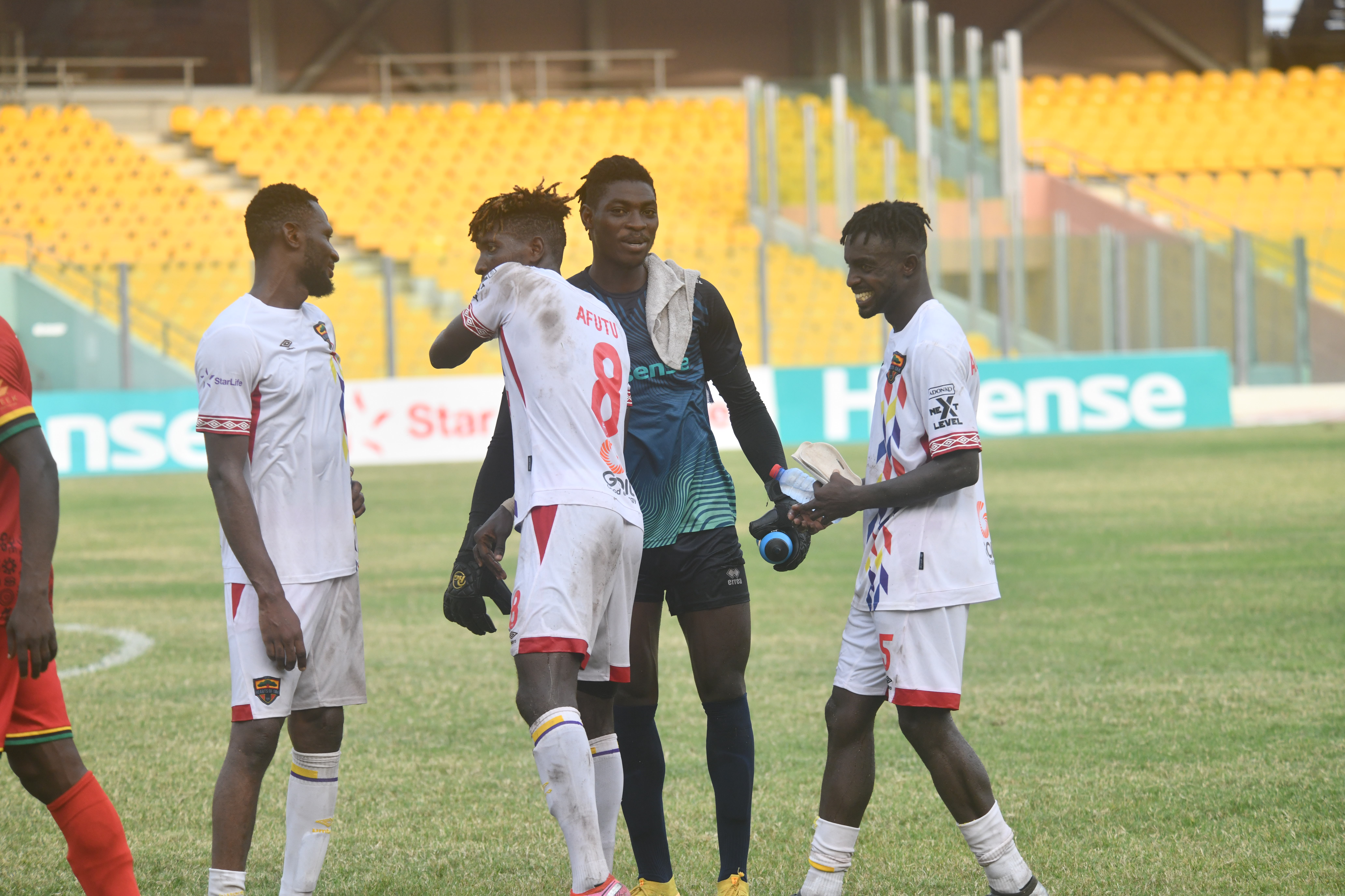 Kotoko's dependable goalkeeper Razak Abalora (second right) poses with a section of Hearts players after their match Abalora, Attah show class in Hearts-Kotoko stalemate