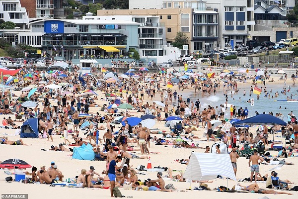 The popular Bondi Beach was teeming with revellers as temperatures in parts of Sydney soared to 40C. Credit: dailymail.co.uk Thousands of young people defy coronavirus rules to mark Australia Day