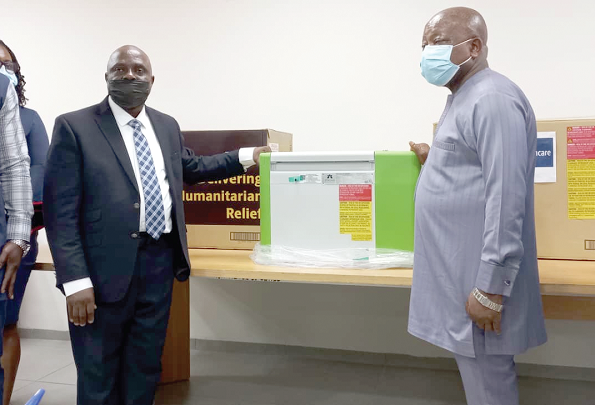 • Mr Bassy Antwi (left), the Manager in charge of Africa Special Project at the UPS, handing over one of the vaccine fridges to Mr Kwaku Agyeman- Manu, the Minister of Health • Mr Bassy Antwi (left), the Manager in charge of Africa Special Project at the UPS, handing over one of the vaccine fridges to Mr Kwaku Agyeman- Manu, the Minister of Health