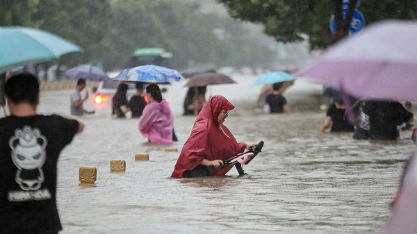 Henan floods: 12 dead in Zhengzhou train and thousands evacuated in China