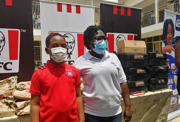 Oswald with his favourite teacher, Mrs Appiah Oswald with his favourite teacher, Mrs Appiah
