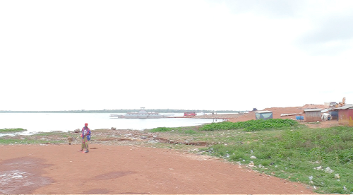 The banks of the Oti River littered with plastic waste The banks of the Oti River littered with plastic waste