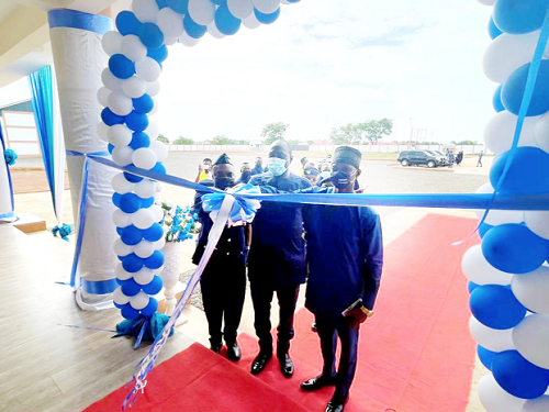 Col (Retd) Kwadwo Damoah (middle), Commissioner of the Customs Division of GRA, being assisted by Assistant Commissioner of Customs Raphael Owurani-Bediako (right), the Tamale Sector Commander and Mr Osman (left), the Managing Director of Savanna Works Limited, to cut the ribbon to inaugurate the state warehouse and new block of offices Col (Retd) Kwadwo Damoah (middle), Commissioner of the Customs Division of GRA, being assisted by Assistant Commissioner of Customs Raphael Owurani-Bediako (right), the Tamale Sector Commander and Mr Osman (left), the Managing Director of Savanna Works Limited, to cut the ribbon to inaugurate the state warehouse and new block of offices