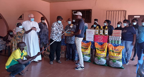 The Country Representative of CRS, Mr Daniel Mumuni (right) presenting an item to Mr George Quansah, the Administrator of the Weija Leprosarium The Country Representative of CRS, Mr Daniel Mumuni (right) presenting an item to Mr George Quansah, the Administrator of the Weija Leprosarium