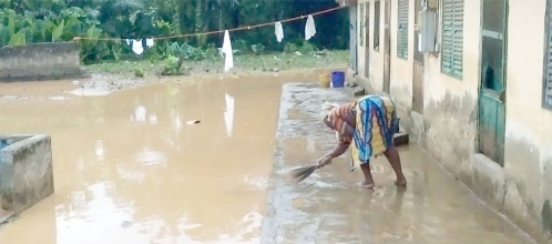 A tenant cleaning up after the flood A tenant cleaning up after the flood