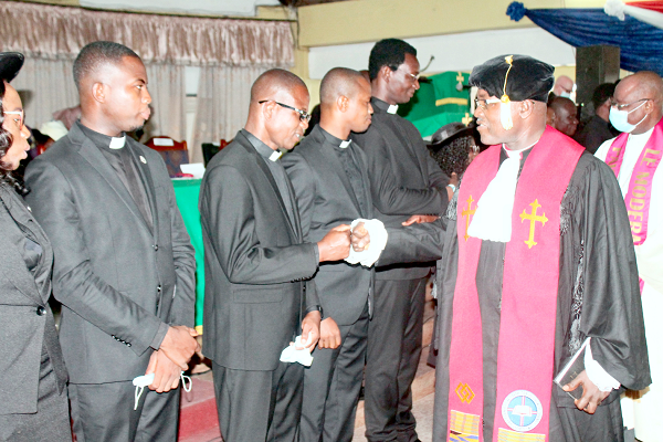 • Rt Rev. Lt Col Bliss Divine Kofi Agbeko (retd) (right), Moderator of the General Assembly, Evangelical Presbyterian Church, Ghana, exchanging pleasantries with the newly commissioned ministers. • Rt Rev. Lt Col Bliss Divine Kofi Agbeko (retd) (right), Moderator of the General Assembly, Evangelical Presbyterian Church, Ghana, exchanging pleasantries with the newly commissioned ministers.
