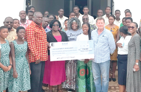 • Professor Ernest Aryeetey (3rd left), President of the OAA, receiving the cheque from Mr David Harper, CEO of Geodrill, while some staff and students look on • Professor Ernest Aryeetey (3rd left), President of the OAA, receiving the cheque from Mr David Harper, CEO of Geodrill, while some staff and students look on