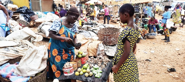 Madam Cecilia Dapaah attending to a customer