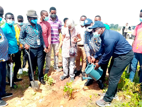 Prof Samuel Nii Odai (2nd right), Vice-Chancellor of ATU and Prof Amevi Acakpovi (right), Pro Vice-Chancellor of the university, watering a seedling they had planted Prof Samuel Nii Odai (2nd right), Vice-Chancellor of ATU and Prof Amevi Acakpovi (right), Pro Vice-Chancellor of the university, watering a seedling they had planted