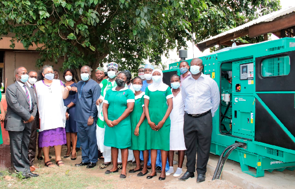 •Mr Eric Asubonteng (3rd left), President of the Chamber of Mines, and Dr Anfu Okine (2nd left), Medical Superintendent, Maamobi General Hospital, with staff of the two institutions after the handing over ceremony. Chamber of Mines installs generator for Maamobi Hospital