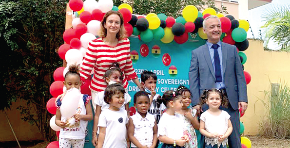 Mrs Ozlem Ergun Ulueren, Turkish Ambassador to Ghana, and Mr Zekai Özgün, Director of Maarif International School, with the pupils after the ceremony Mrs Ozlem Ergun Ulueren, Turkish Ambassador to Ghana, and Mr Zekai Özgün, Director of Maarif International School, with the pupils after the ceremony