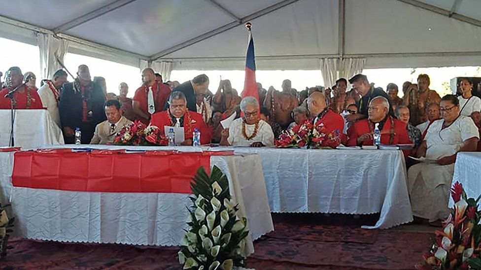 Fiame Naomi Mata'afa (pictured centre, in white) is sworn in at the makeshift ceremony Fiame Naomi Mata'afa (pictured centre, in white) is sworn in at the makeshift ceremony