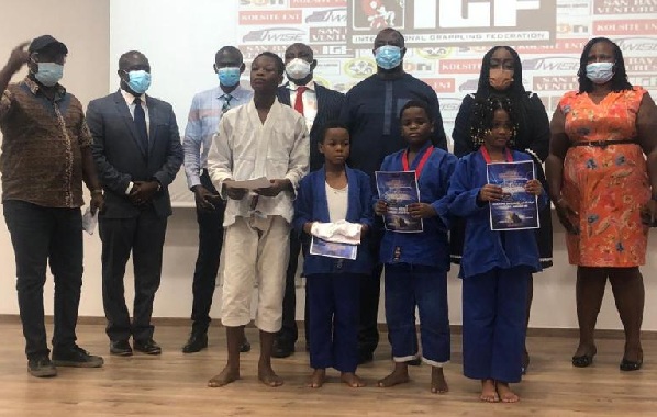The young Jiu Jitsu athletes with some officials of the GJJF and EXIM Bank The young Jiu Jitsu athletes with some officials of the GJJF and EXIM Bank