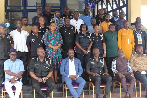 Ghana Police Service pose with GFA officials Police to improve security at league centres