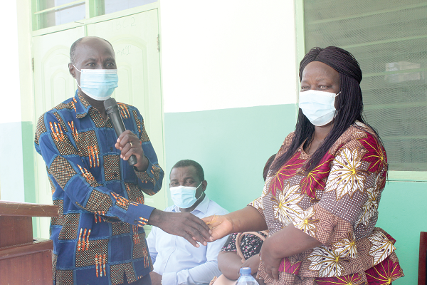 Mr Edward Ansah (left), Engineer of Ecobuild Consult, handing over the keys of the newly constructed six-unit classroom block to Ms Pearl Bruce, the Headmistress of Kaneshie Senior High Technical School. Picture: Patrick Dickson Mr Edward Ansah (left), Engineer of Ecobuild Consult, handing over the keys of the newly constructed six-unit classroom block to Ms Pearl Bruce, the Headmistress of Kaneshie Senior High Technical School. Picture: Patrick Dickson