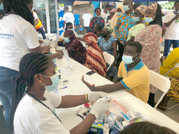 A resident of Kasoa being attended to at the health screening A resident of Kasoa being attended to at the health screening