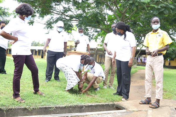 Members of the 1972 year group planting a tree on the school's compound while Ms Golda Esi Andam (left), Headmistress of SWESCO, looks on Members of the 1972 year group planting a tree on the school's compound while Ms Golda Esi Andam (left), Headmistress of SWESCO, looks on