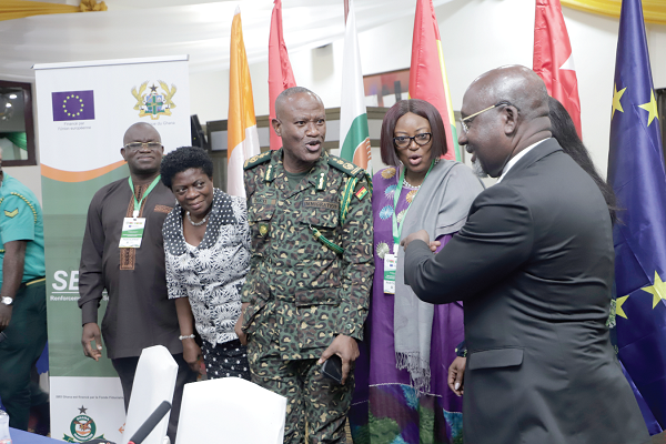 Mr Alcide Djedje (right), Minister Delegate in charge of African Integration, Cote d'Ivoire; Mr Kwame Asuah Takyi (3rd from left), Comptroller-General of the Ghana Immigration Service; Mrs Adelaide Anno-Kumi (2nd from left), Chief Director of the Ministry of the Interior, and other delegates interacting after the ceremony. Picture: EDNA SALVO-KOTEY Mr Alcide Djedje (right), Minister Delegate in charge of African Integration, Cote d'Ivoire; Mr Kwame Asuah Takyi (3rd from left), Comptroller-General of the Ghana Immigration Service; Mrs Adelaide Anno-Kumi (2nd from left), Chief Director of the Ministry of the Interior, and other delegates interacting after the ceremony. Picture: EDNA SALVO-KOTEY