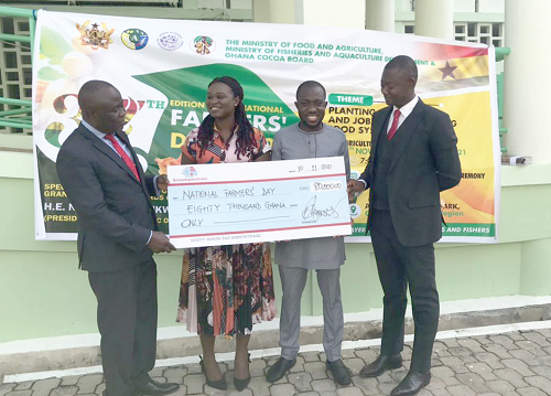 Mr Razak Awudulai (right), Group Chief Executive Officer of Broadspectrum Ghana Limited, presenting a dummy cheque for GH¢80,000 to Mr Yaw Frimpong Addo (left), a Deputy Minister of Food and Agriculture, while some staff of the company look on Mr Razak Awudulai (right), Group Chief Executive Officer of Broadspectrum Ghana Limited, presenting a dummy cheque for GH¢80,000 to Mr Yaw Frimpong Addo (left), a Deputy Minister of Food and Agriculture, while some staff of the company look on