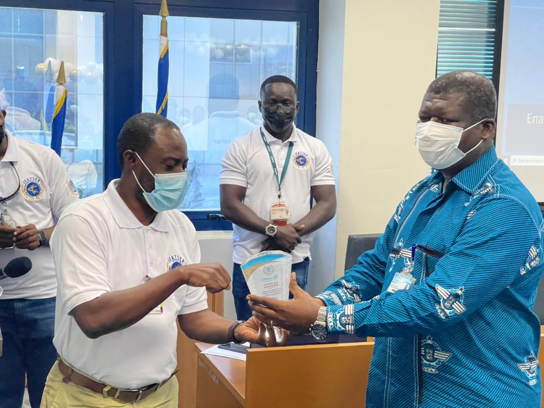 Ing Charles Kraikue (left), Director General, GCAA presenting a plaque to a recipient at the event GCAA