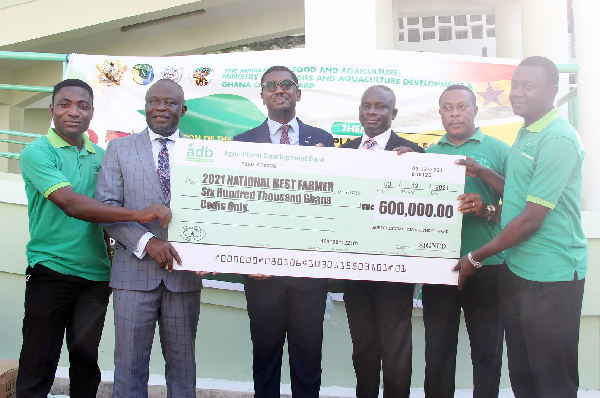 Mr Kwame Asiedu Attrams (3rd from left), General Manager in charge of Agri- Business, ADB, presenting a dummy cheque for the sponsorship of the National Farmers Day celebration to Mr Yaw Frimpong Addo (2nd from left), Deputy Minister of Food and Agriculture Mr Kwame Asiedu Attrams (3rd from left), General Manager in charge of Agri- Business, ADB, presenting a dummy cheque for the sponsorship of the National Farmers Day celebration to Mr Yaw Frimpong Addo (2nd from left), Deputy Minister of Food and Agriculture
