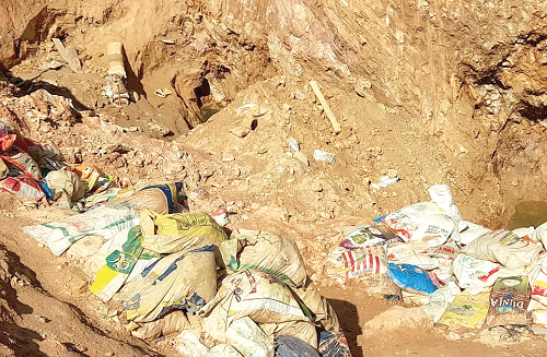 The pit (arrowed) in which the 10 galamsayers died