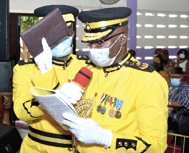Mr. Isaac Kofi Egyir, the newly inducted Director- General of the Ghana Prisons Service, taking an oath at the induction ceremony. Picture: GABRIEL AHIABOR Mr. Isaac Kofi Egyir, the newly inducted Director- General of the Ghana Prisons Service, taking an oath at the induction ceremony. Picture: GABRIEL AHIABOR