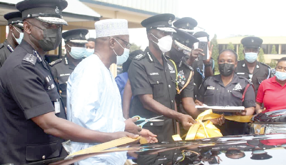Alhaji Ibrahim Zakari (2nd from left) assisting Dr. George Akuffo Dampare to cut a ribbon before handing over the vehicles Alhaji Ibrahim Zakari (2nd from left) assisting Dr. George Akuffo Dampare to cut a ribbon before handing over the vehicles