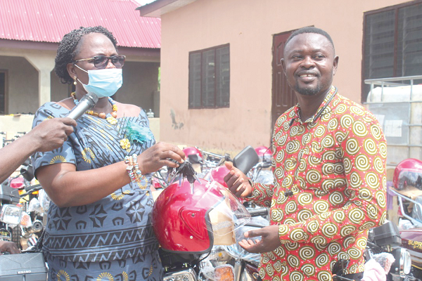 Mrs Justina Owusu-Banahene (left), Bono Regional Minister, presenting the keys to Mr Joseph Baffour Awuah, the Dean of the Presiding Members Mrs Justina Owusu-Banahene (left), Bono Regional Minister, presenting the keys to Mr Joseph Baffour Awuah, the Dean of the Presiding Members