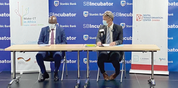  Mr Kwamina K. Asomaning (left), CEO of Stanbic Bank Ghana, and Mr Gerald Guskowski, Head of the Network for Inclusive Economic Development cluster at GIZ,  after signing the agreement 