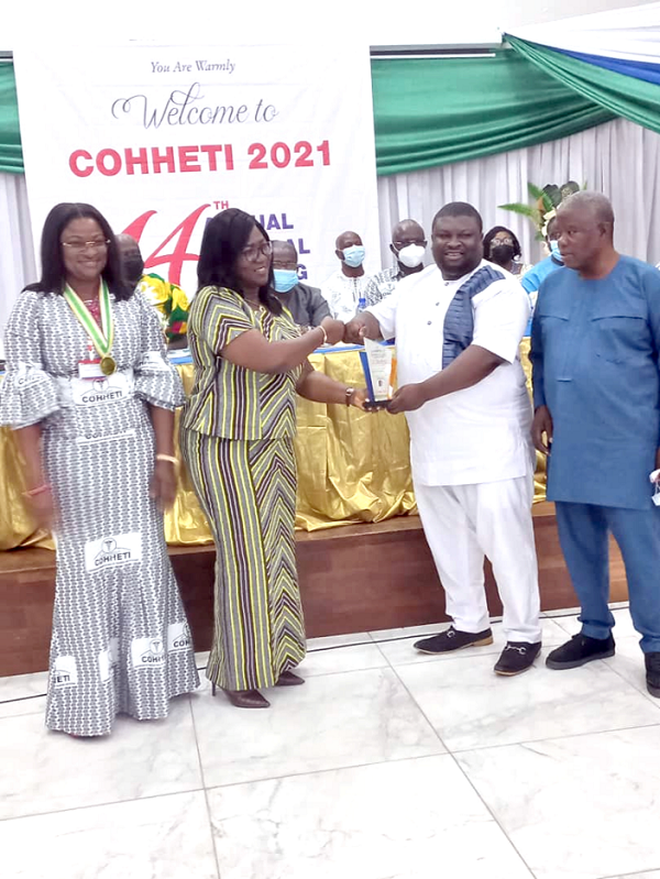 Dr Beyere (2nd from right), receiving his award from the Secretary of COHHETI, Ms Margaret Mary Alacoque (2nd from left) Dr Beyere (2nd from right), receiving his award from the Secretary of COHHETI, Ms Margaret Mary Alacoque (2nd from left)
