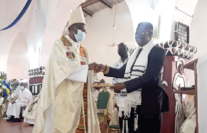 Mr. John-Peter Amewu (right), the Minister of Railway Development, presenting GH¢20,000, on behalf of the Vice-President, Dr. Mahamudu Bawumia, to Most Rev. Alfred Agyenta, the Bishop of the Navrongo-Bolgatanga Diocese Mr. John-Peter Amewu (right), the Minister of Railway Development, presenting GH¢20,000, on behalf of the Vice-President, Dr. Mahamudu Bawumia, to Most Rev. Alfred Agyenta, the Bishop of the Navrongo-Bolgatanga Diocese