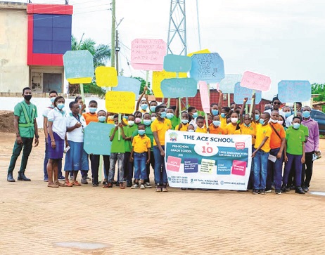 Pupils of the Ace School with their teachers during the walk. Ace School pupils embark on covid-19 sensitisation exercise