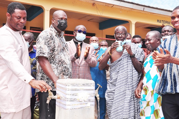 Mr Francis Poku (2nd left), CEO of Afriwave Telecom, and some elders of the community look on as Nana Osei Yaw, chief of Ekye-Amanfrom, takes a sip of the water after the facility was commissioned Mr Francis Poku (2nd left), CEO of Afriwave Telecom, and some elders of the community look on as Nana Osei Yaw, chief of Ekye-Amanfrom, takes a sip of the water after the facility was commissioned