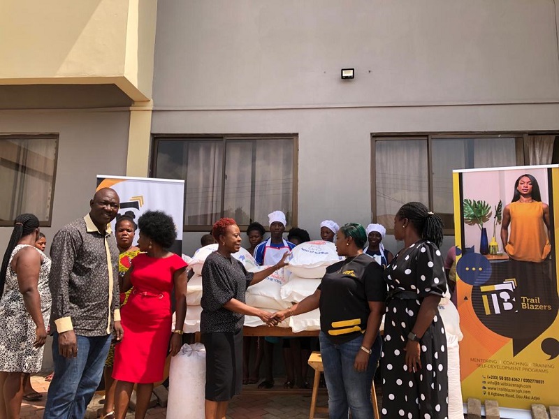 Gifty Takyi (2nd right), the Administrator for Trailblazers presenting the items to Irene Engmann (3rd left), the Deputy Director for Street Girls Aid Shelter Trailblazers supports Street Girls Aid
